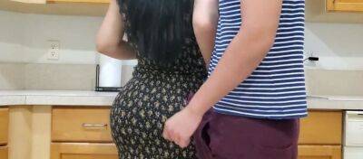 Voluptuous mommy is banged by her randy stepson in the kitchen while making dinner on sexyblondegirl.com