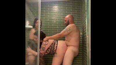 Voluptuous brunette with big boobs is getting fucked from the back, during a threesome in the shower on sexyblondegirl.com